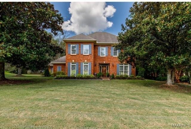 colonial home with a front yard