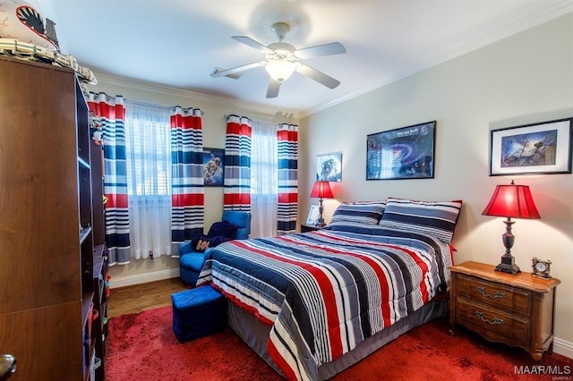 bedroom featuring ceiling fan, dark hardwood / wood-style flooring, and ornamental molding