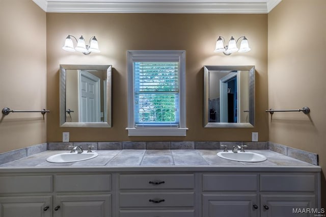 bathroom featuring crown molding and vanity