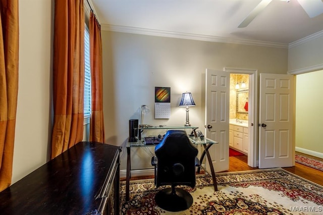 office space featuring hardwood / wood-style flooring, ceiling fan, and crown molding