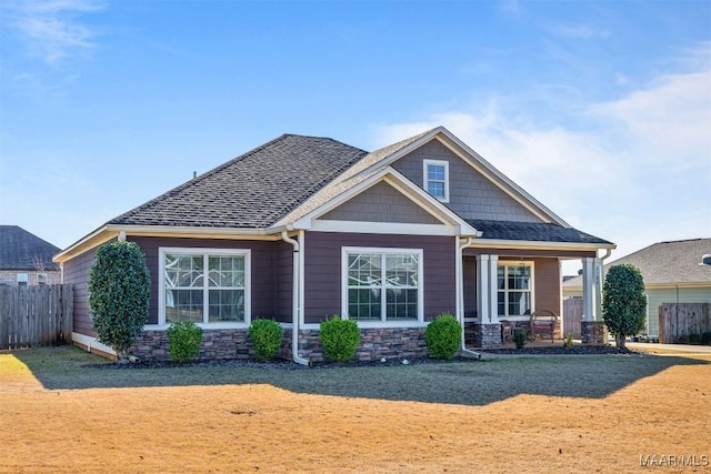 exterior space with a front yard and a porch