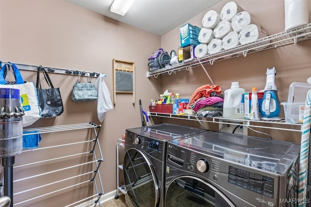 clothes washing area featuring independent washer and dryer