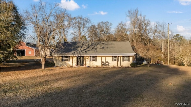 ranch-style home with a front lawn