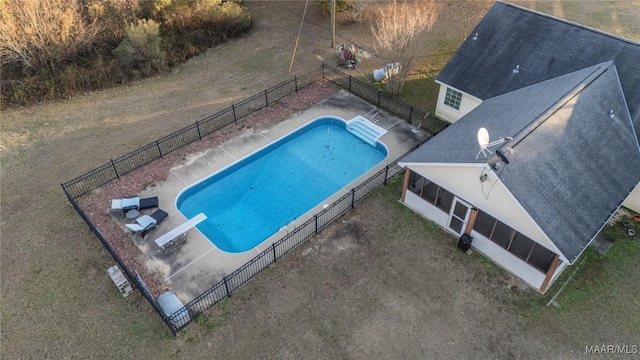 view of pool featuring a diving board