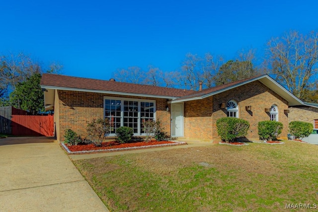 ranch-style house with a front yard