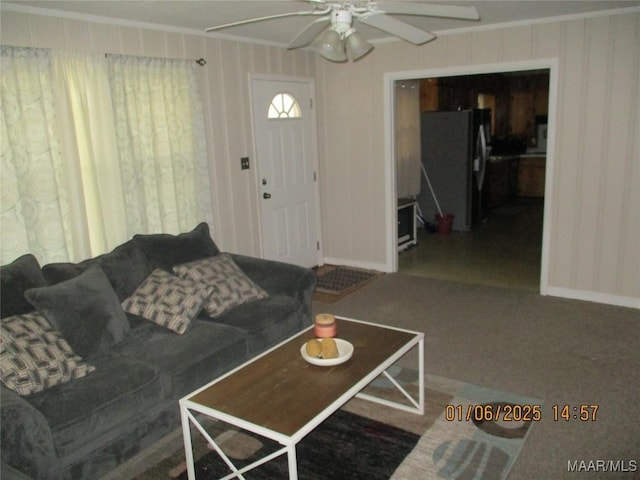 living room with ceiling fan and carpet