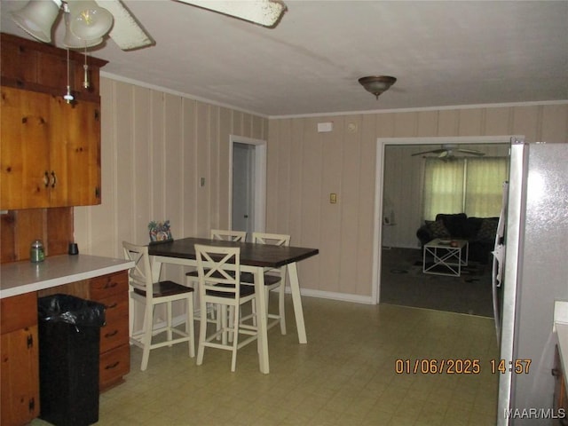 dining area featuring crown molding