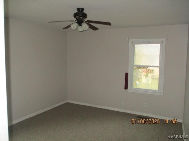 spare room with ceiling fan and carpet floors