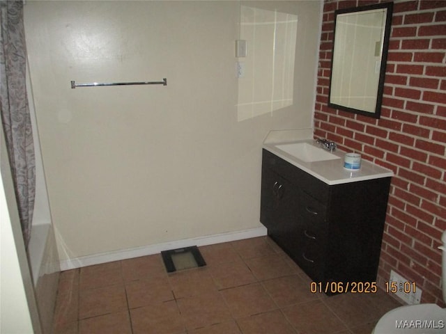 bathroom featuring a tub to relax in, tile patterned flooring, vanity, and toilet