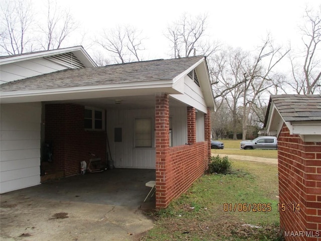 view of side of property featuring a carport