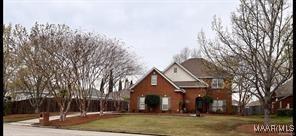 view of property featuring a front yard