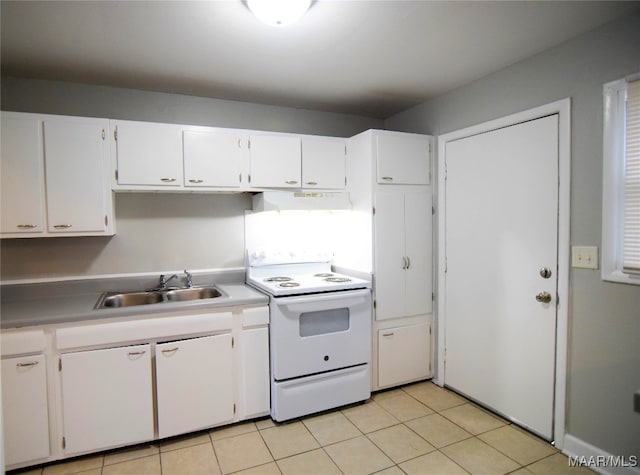 kitchen featuring white cabinets, white electric range, light tile patterned flooring, and sink