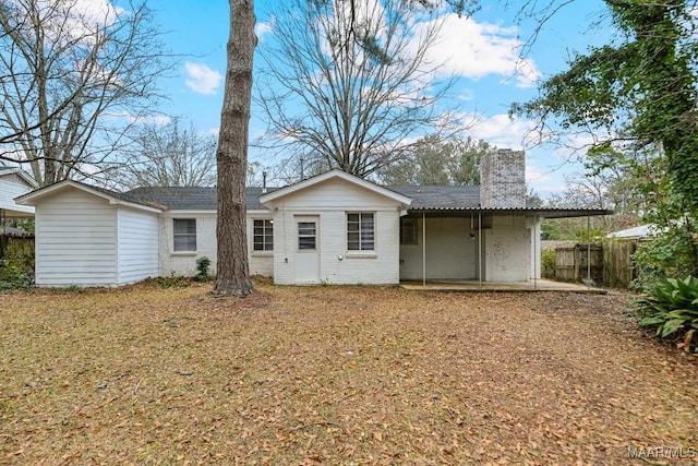 rear view of house featuring a patio area