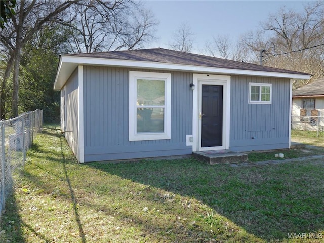 view of outdoor structure with a lawn