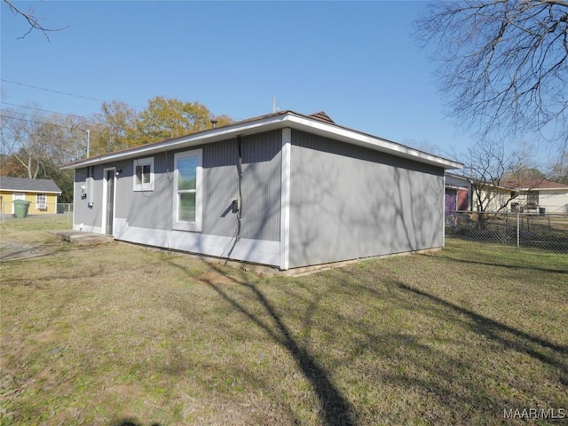 view of home's exterior with a yard