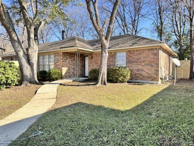 ranch-style home with a front yard