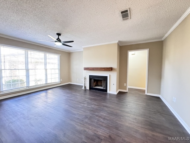 unfurnished living room with crown molding, dark hardwood / wood-style flooring, ceiling fan, and a textured ceiling