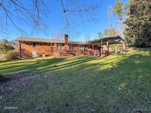 rear view of house with a lawn