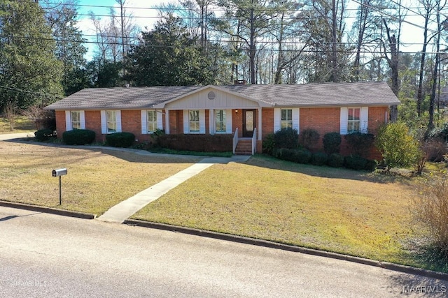 single story home featuring a front lawn