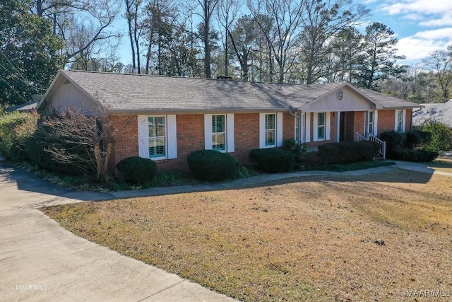 ranch-style home with a front lawn