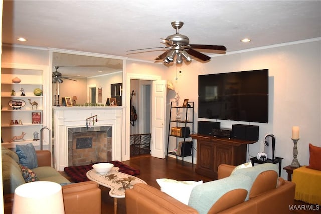 living room with built in shelves, dark wood-type flooring, and crown molding