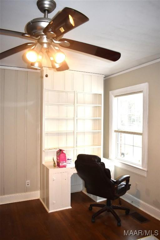 home office featuring dark hardwood / wood-style flooring, ceiling fan, and crown molding