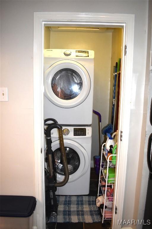 washroom with stacked washer / dryer