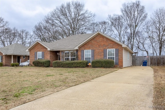 ranch-style home featuring a front yard