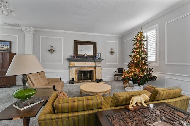 carpeted living room with a textured ceiling and ornamental molding