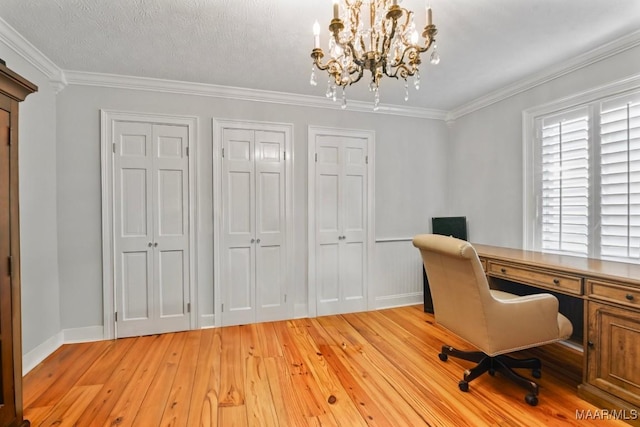 office area with light hardwood / wood-style flooring, ornamental molding, a textured ceiling, and an inviting chandelier