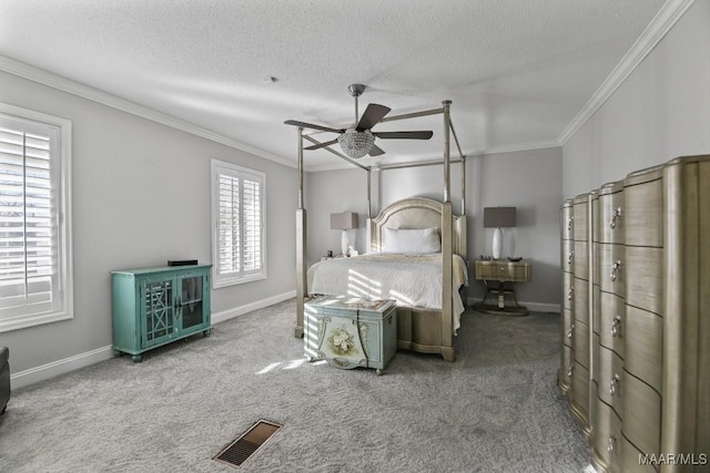 bedroom featuring carpet, a textured ceiling, ceiling fan, and ornamental molding