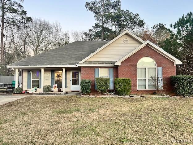 ranch-style home with a front lawn