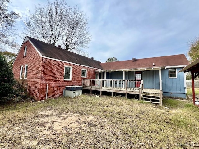 back of property featuring a deck