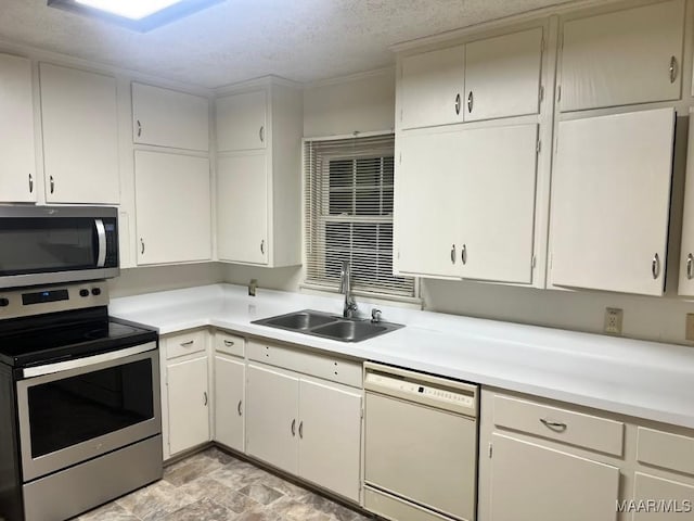 kitchen with white cabinetry, sink, and stainless steel appliances