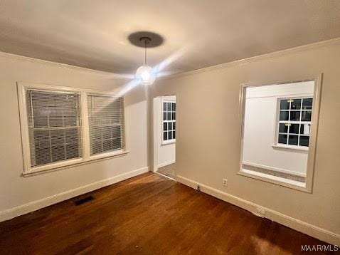 empty room featuring dark wood-type flooring