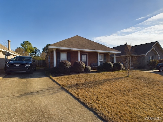 view of front of home featuring a porch and a front yard