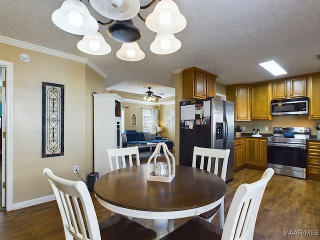 dining room with dark hardwood / wood-style flooring, a textured ceiling, ceiling fan, and crown molding