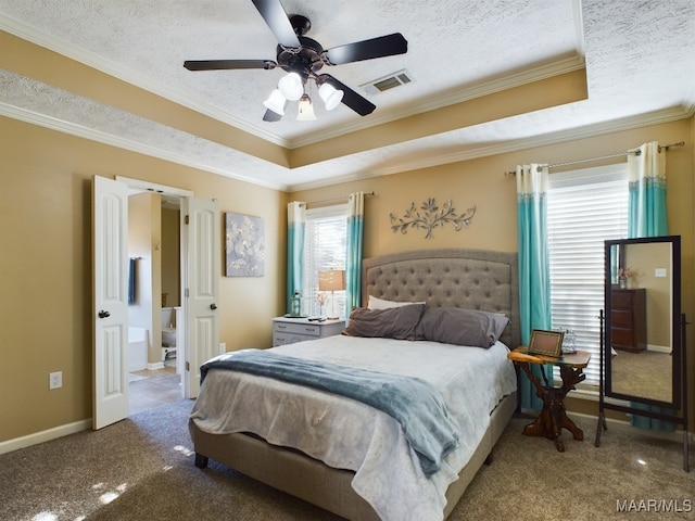 bedroom with a textured ceiling, carpet floors, a raised ceiling, and ceiling fan