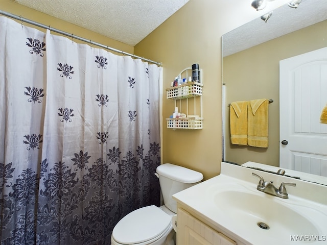 bathroom with vanity, a shower with shower curtain, a textured ceiling, and toilet