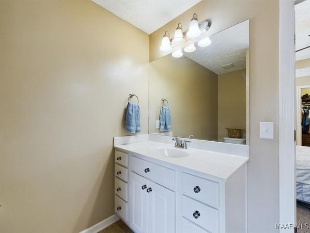 bathroom featuring vanity and a textured ceiling