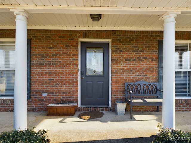 property entrance featuring a porch