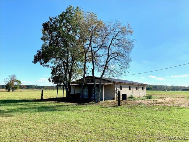 exterior space with a rural view