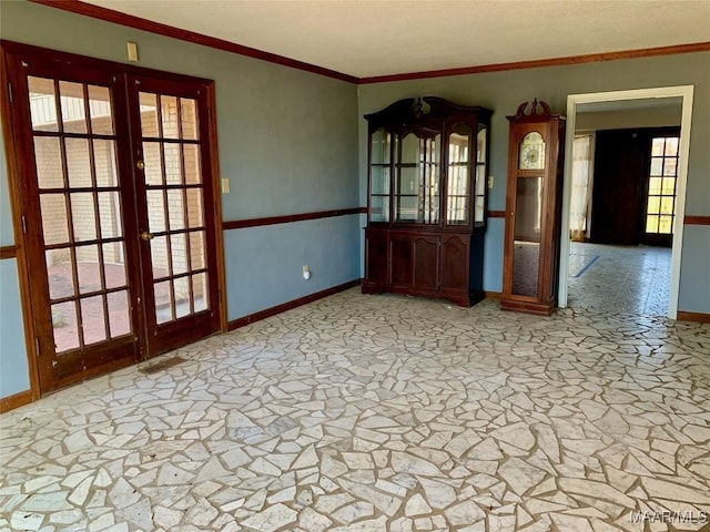 unfurnished room with french doors and ornamental molding