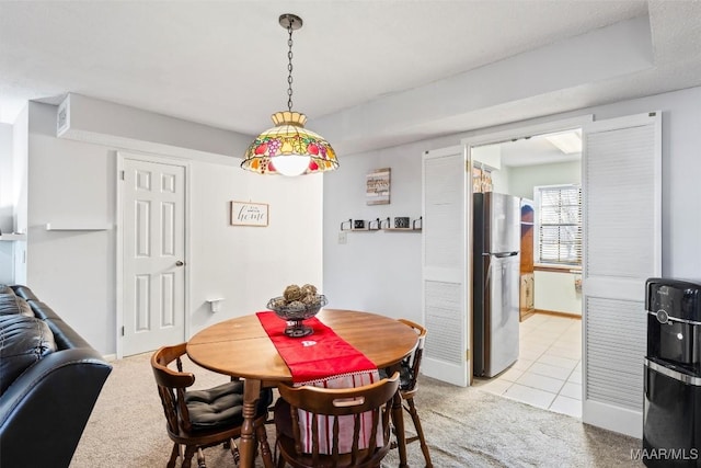 dining space with light colored carpet