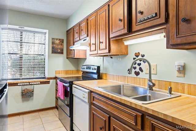 kitchen featuring white dishwasher, stainless steel electric range oven, a healthy amount of sunlight, and sink