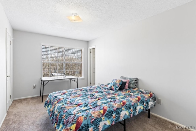 bedroom with carpet and a textured ceiling