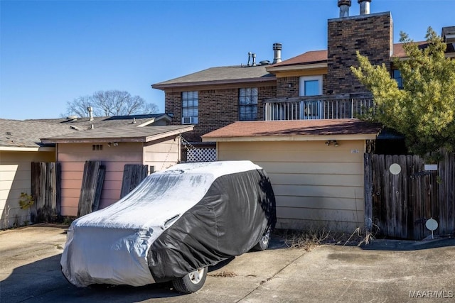 rear view of property with a balcony