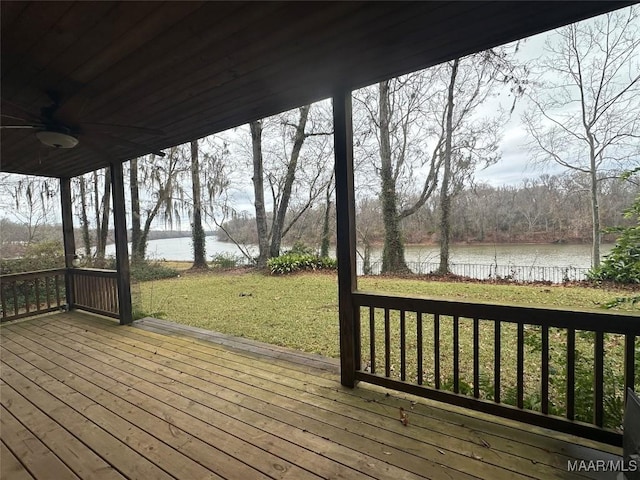 deck featuring a yard, a water view, and ceiling fan