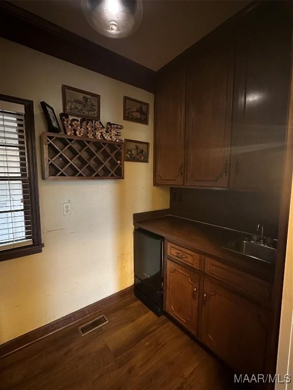 kitchen with dark hardwood / wood-style floors and sink