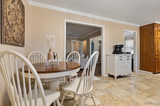 dining area featuring crown molding and a textured ceiling